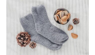 man twirls proud socked bottle