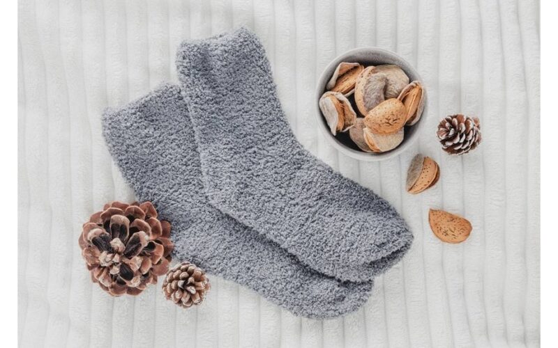 man twirls proud socked bottle